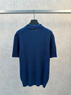 Blue cable-knit polo shirt back view with ribbed collar and short sleeves