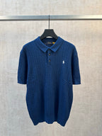 Blue cable-knit polo shirt with short sleeves and button placket