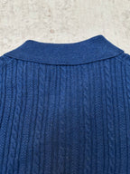 Blue cable-knit polo shirt back yoke with ribbed collar