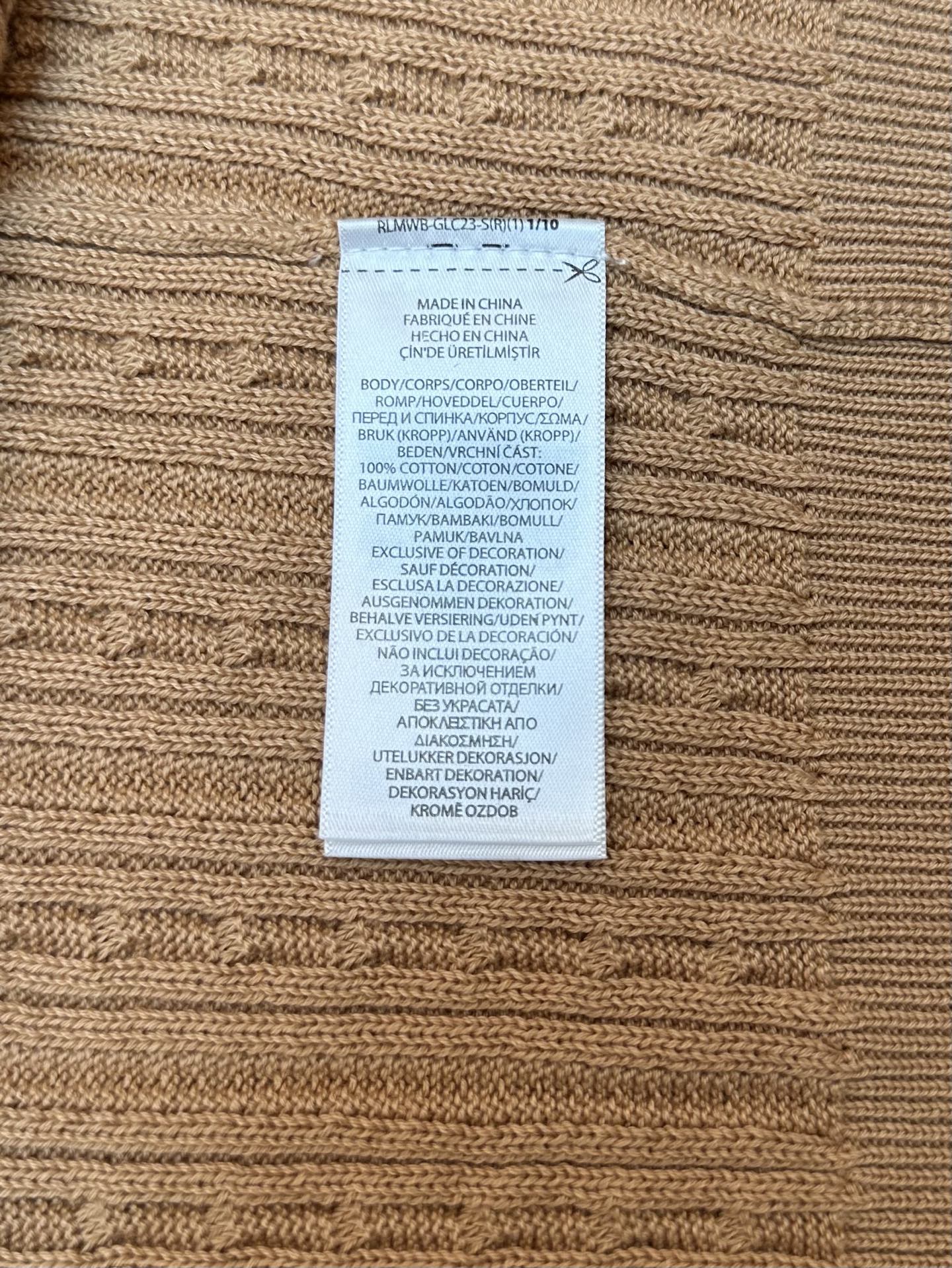 Tan knit polo care label sewn into inner hem