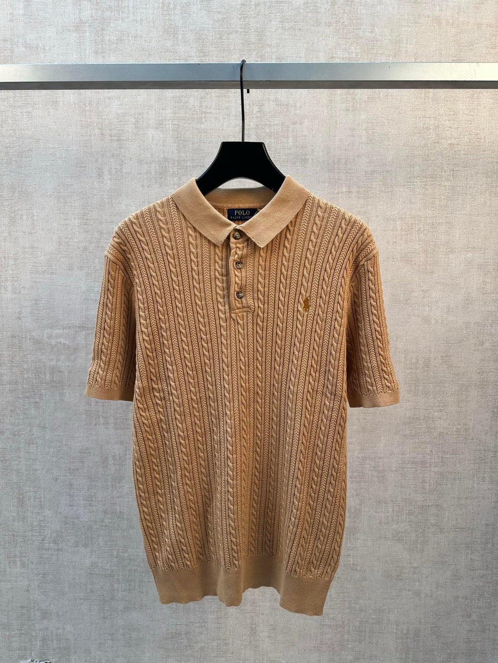 Tan cable-knit polo shirt with short sleeves and 3-button placket
