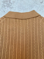 Tan cable-knit polo back with ribbed collar and vertical knit texture