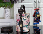 Louis Vuitton bucket-style bag with floral canvas, black leather trim and hanging strap