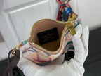 Louis Vuitton patterned pouch bag with gold zipper and wrist strap, open view interior