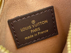 Louis Vuitton leather logo patch with gold text on brown background, stitched edges