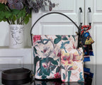 Louis Vuitton shoulder bag with floral multicolor canvas and black leather top handle
