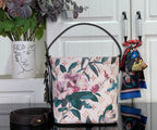 Louis Vuitton shoulder bag with multicolor floral canvas, black leather straps and front pocket