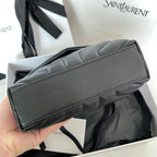 YSL Saint Laurent black leather bag with top edge seam, side view