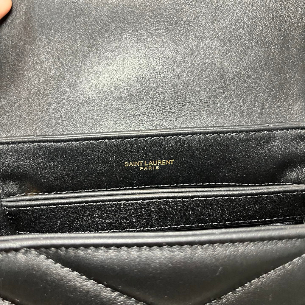 SAINT LAURENT PARIS leather bag label on black interior lining