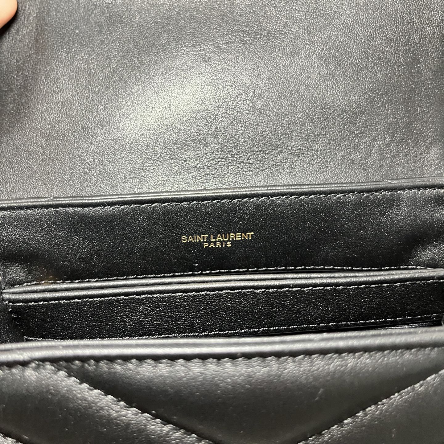 SAINT LAURENT PARIS leather bag label on black interior lining