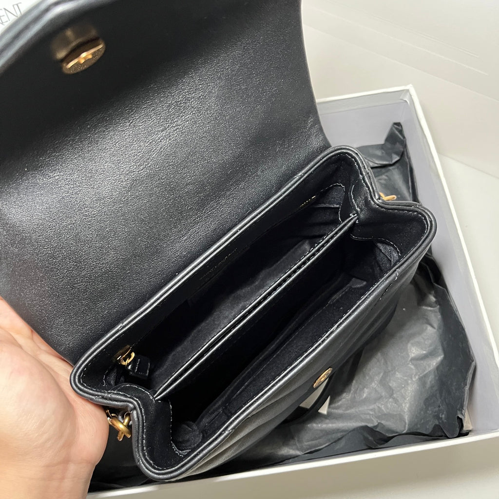 YSL Saint Laurent black leather bag interior with chain strap, open top