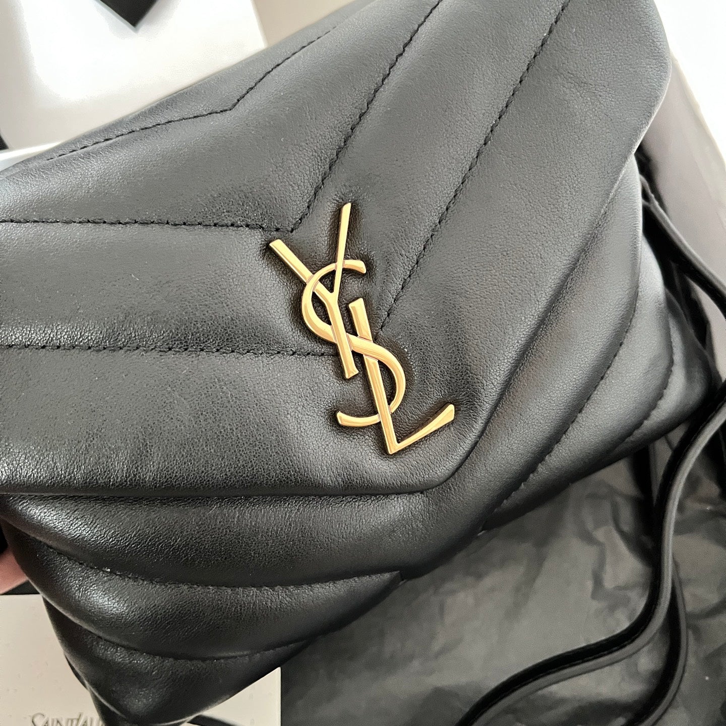 YSL Saint Laurent black leather flap with gold YSL logo detail