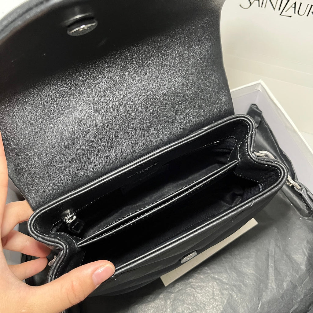 YSL bag open interior with stitched lining and dark leather inner compartment