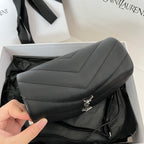 YSL bag with quilted flap, metal YSL clasp, and dark leather crossbody strap