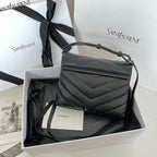 YSL bag in dark leather with top handle and quilted chevron pattern