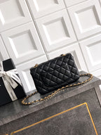 Chanel quilted flap bag in black with gold chain strap and gold-tone hardware