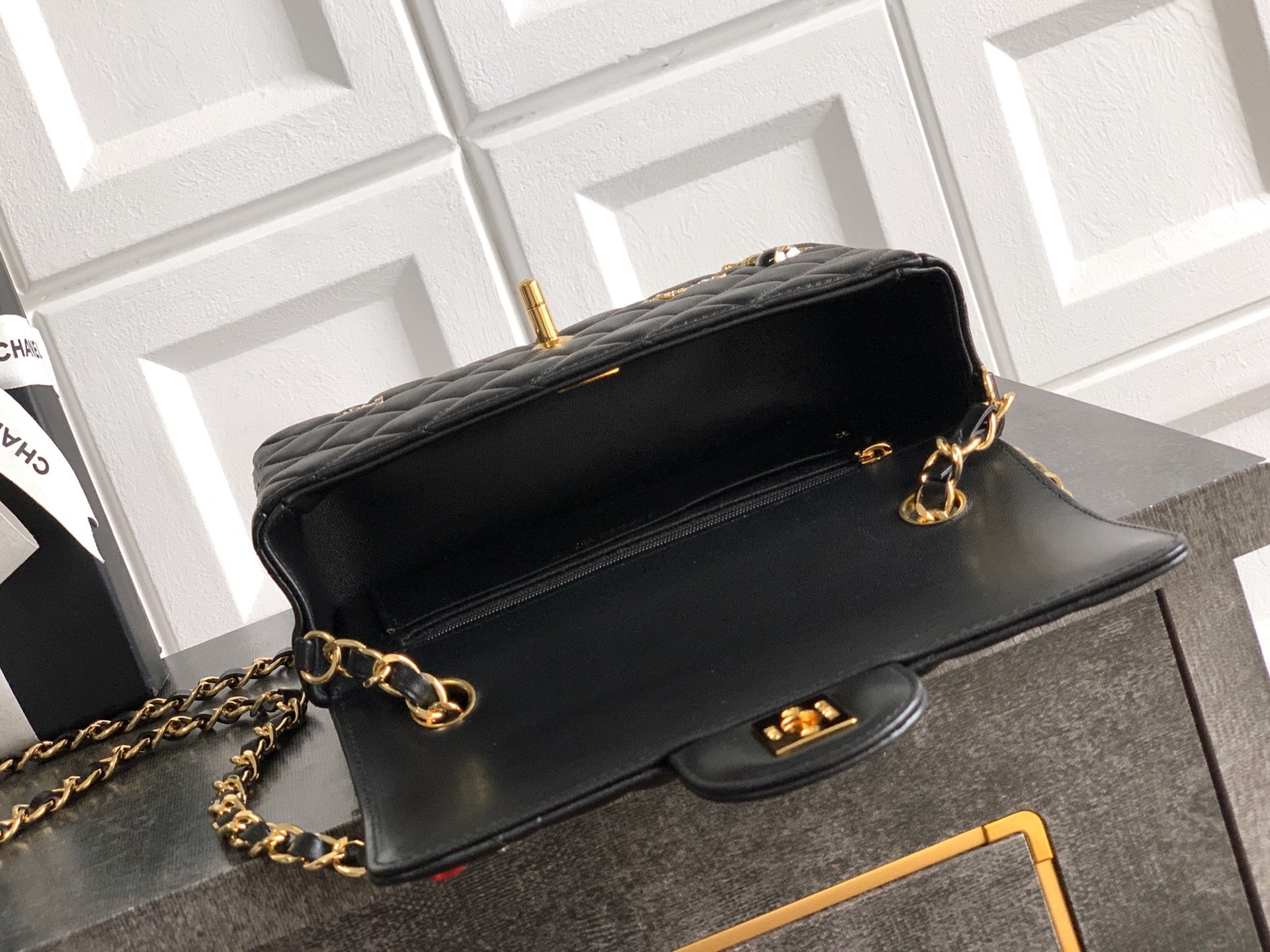 Chanel leather shoulder bag in black with gold-tone chain strap and clasp