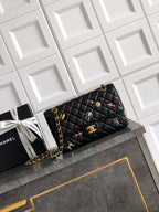 Quilted Chanel shoulder bag in black with gold chain strap and flap closure