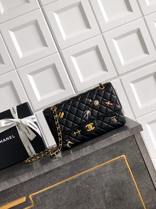 Quilted Chanel shoulder bag in black with gold chain strap and flap closure