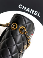 Chanel quilted mini bag with gold chain strap and metal ring hardware