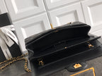 Black Chanel flap shoulder bag with gold chain strap and turn-lock clasp
