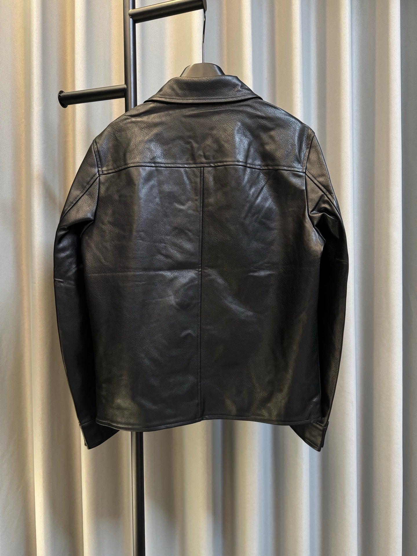 Back view of Prada black leather jacket with full-length sleeves