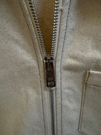 Prada metal zipper on beige canvas jacket with pull tab