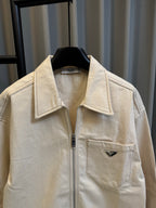 Prada beige canvas jacket with stand collar, zipper, and chest pocket logo