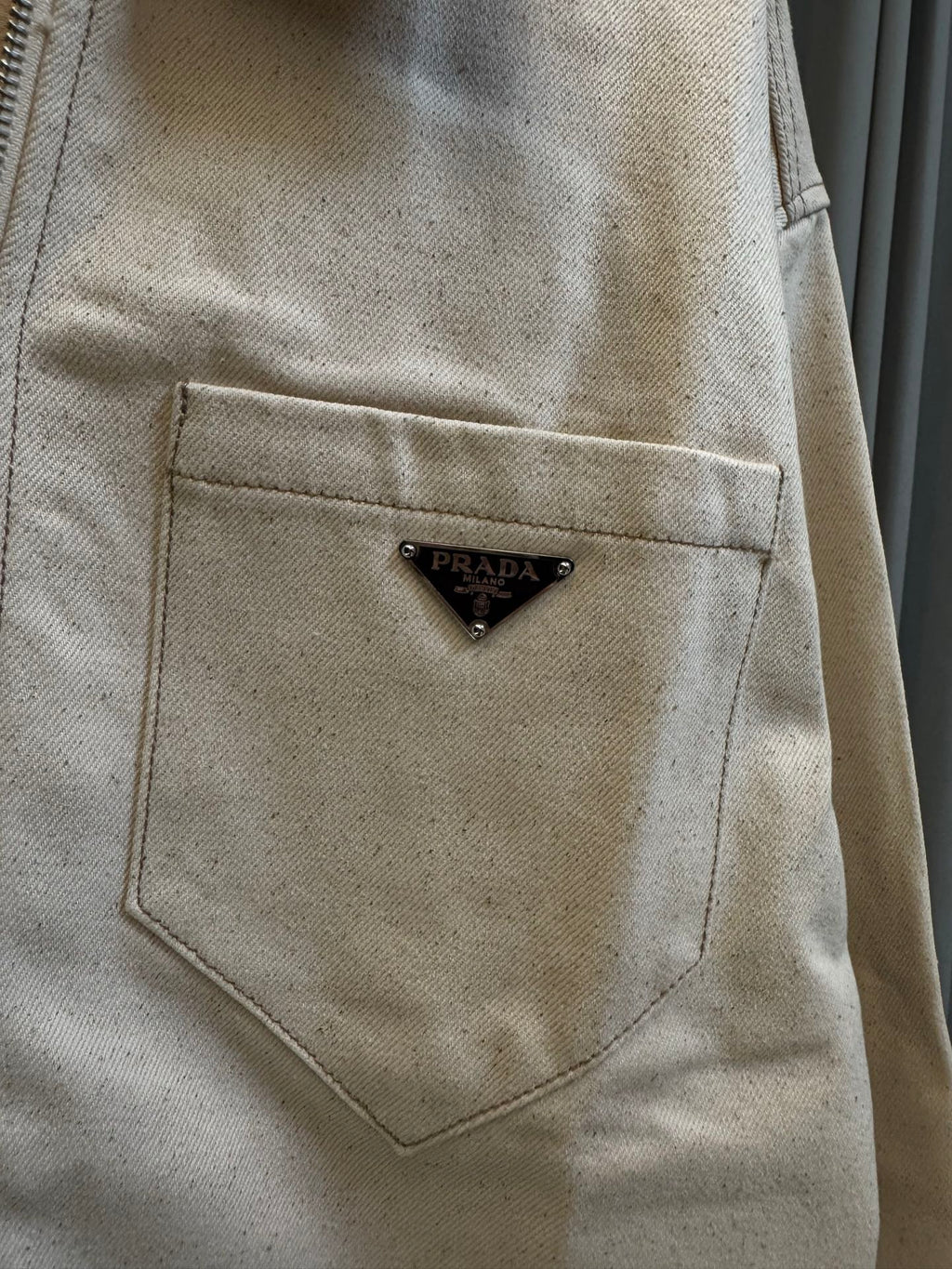 Prada beige canvas chest pocket with triangular logo patch