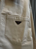 Prada beige canvas chest pocket with triangular logo patch