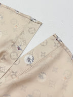 Beige short-sleeve shirt with printed shoulder panel and monogram floral motifs