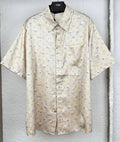 Beige short-sleeve button-up shirt with allover monogram and small floral icons