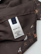 Louis Vuitton shirt care label on inner placket, dark monogram floral fabric