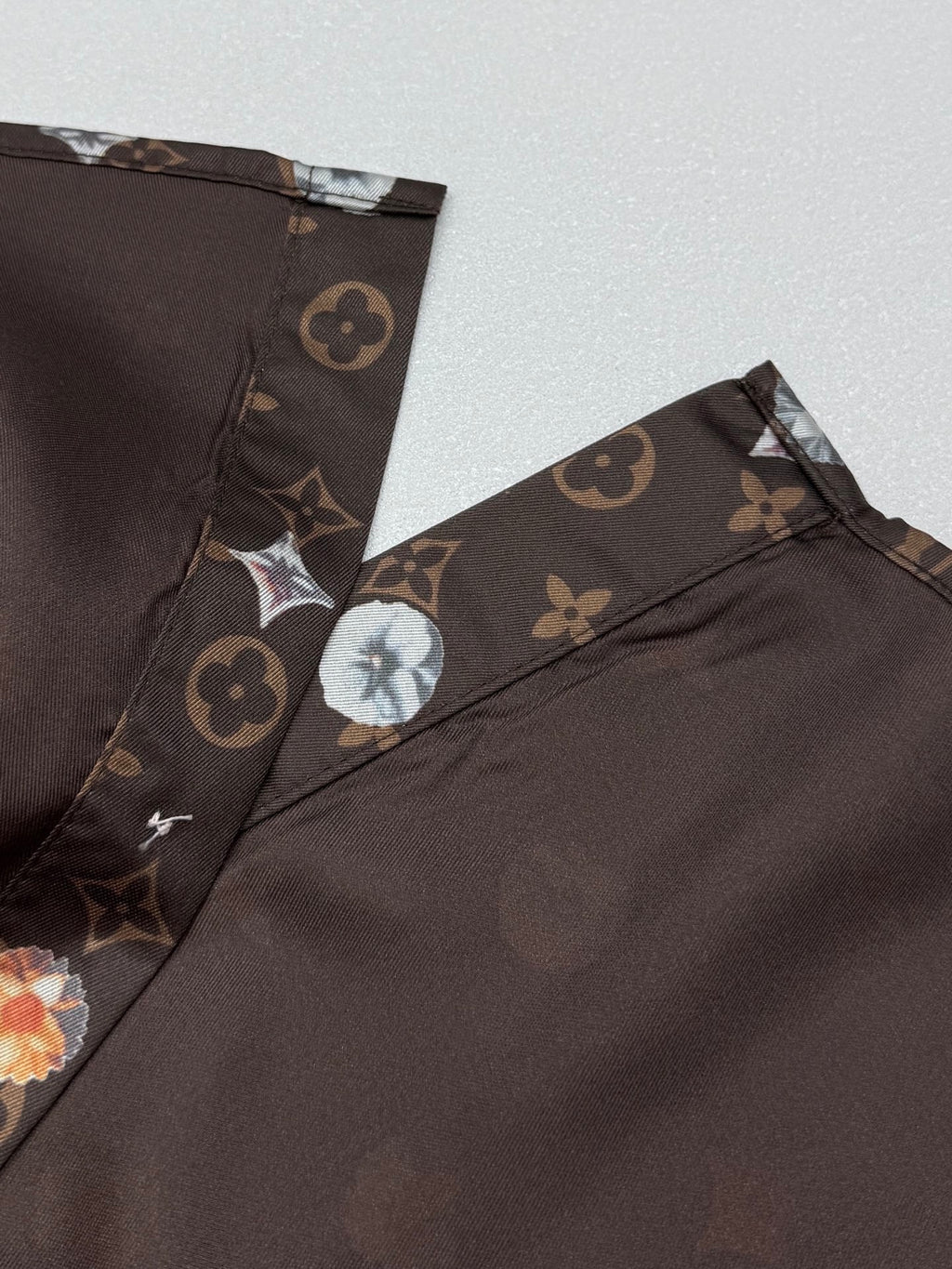 Louis Vuitton short-sleeve shirt hem and side panel, dark monogram print with floral motifs