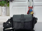 Louis Vuitton black crossbody bag with front flap and adjustable shoulder strap