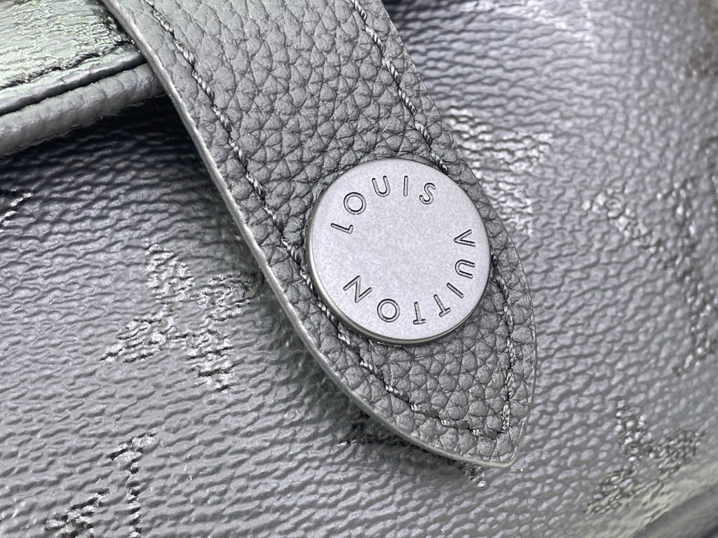 Louis Vuitton leather patch tab with embossed “Louis Vuitton Paris” on black bag