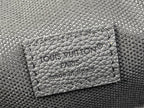 Louis Vuitton embossed card holder panel on black textured crossbody bag