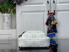 White Louis Vuitton monogram crossbody bag with curved top and visible zipper track