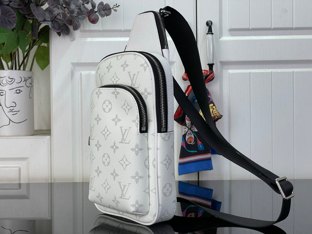 White Louis Vuitton monogram crossbody bag with dual front zipper pulls and strap