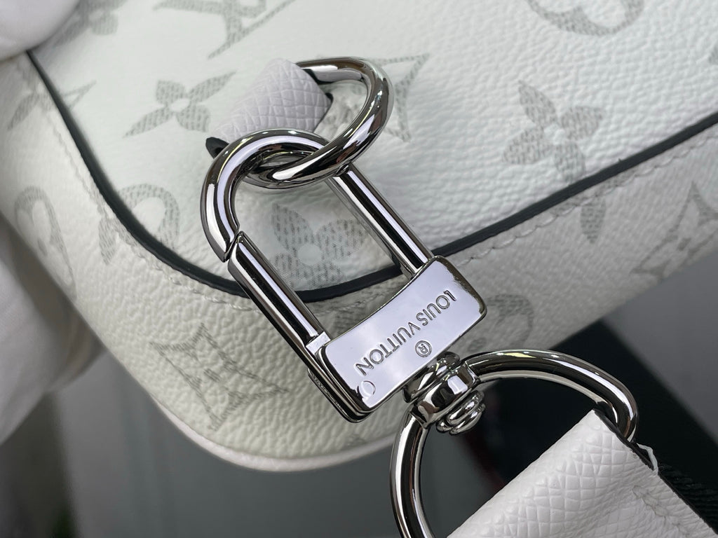 Silver D-ring clasp on white Louis Vuitton monogram crossbody strap