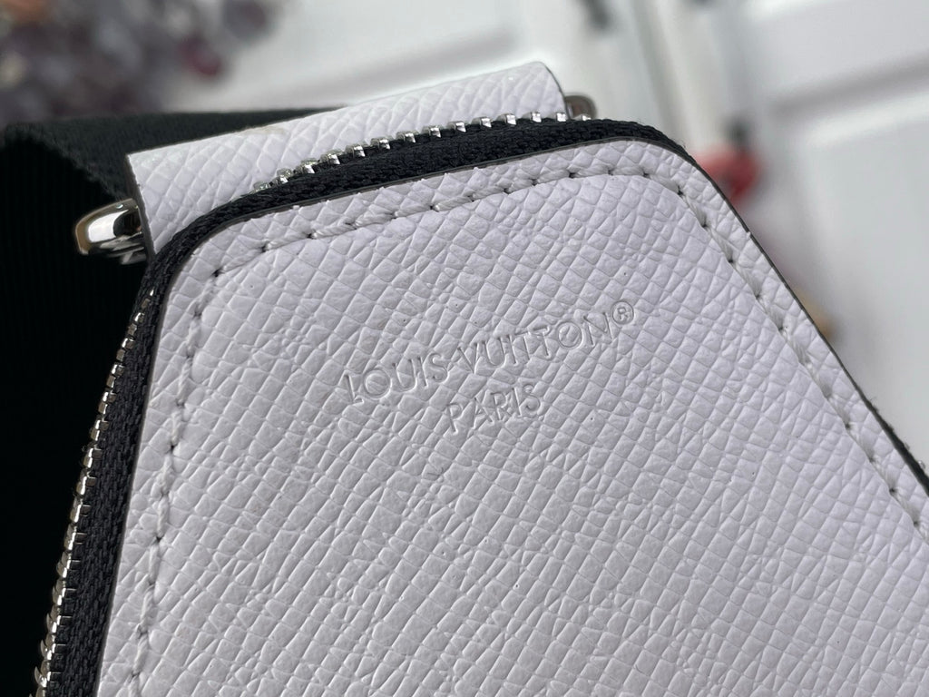 White textured Louis Vuitton leather panel with embossed Louis Vuitton logo