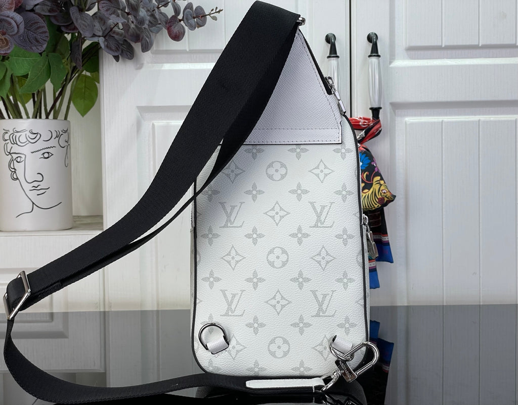White Louis Vuitton monogram crossbody bag with black strap and metal side hardware