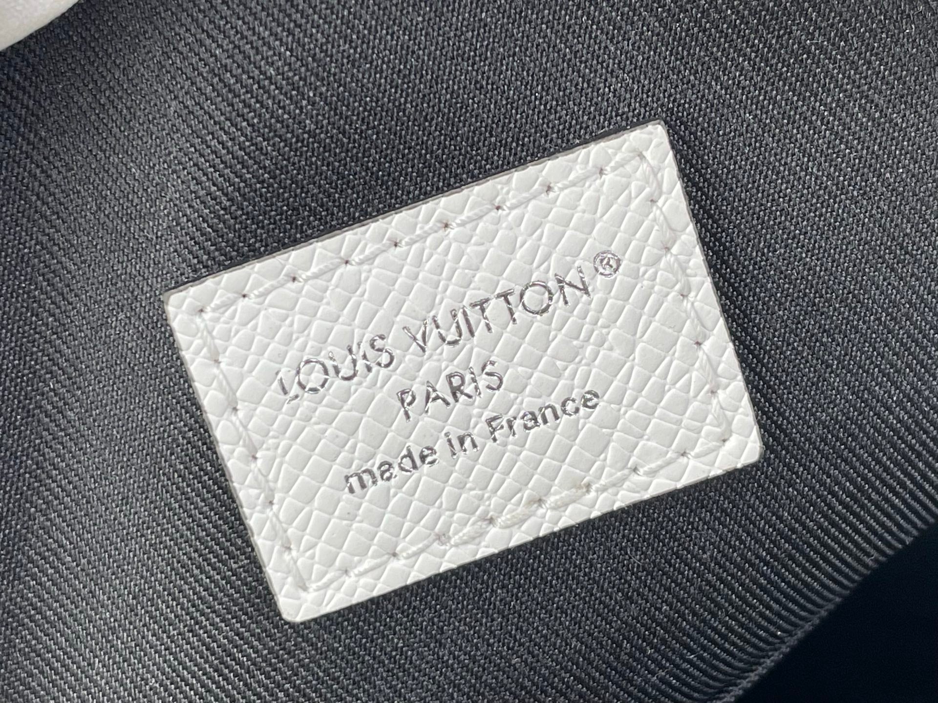 White leather label reading Louis Vuitton Paris, made in France