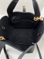 YSL leather mini tote bag interior view, black lining with side pockets and hardware.
