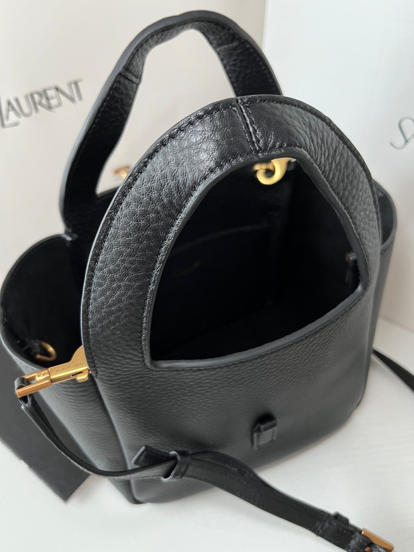 YSL leather mini tote bag, black top opening with gold-tone clasp and inner lining.