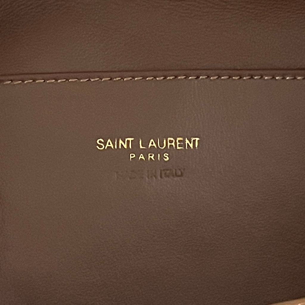 YSL brown leather patch with Saint Laurent Paris logo text and stitching