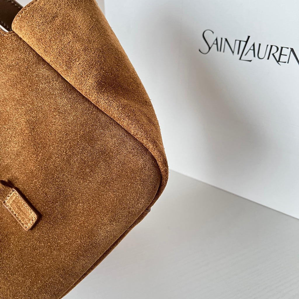 YSL tan suede bag with curved seam detail and partial front logo tab