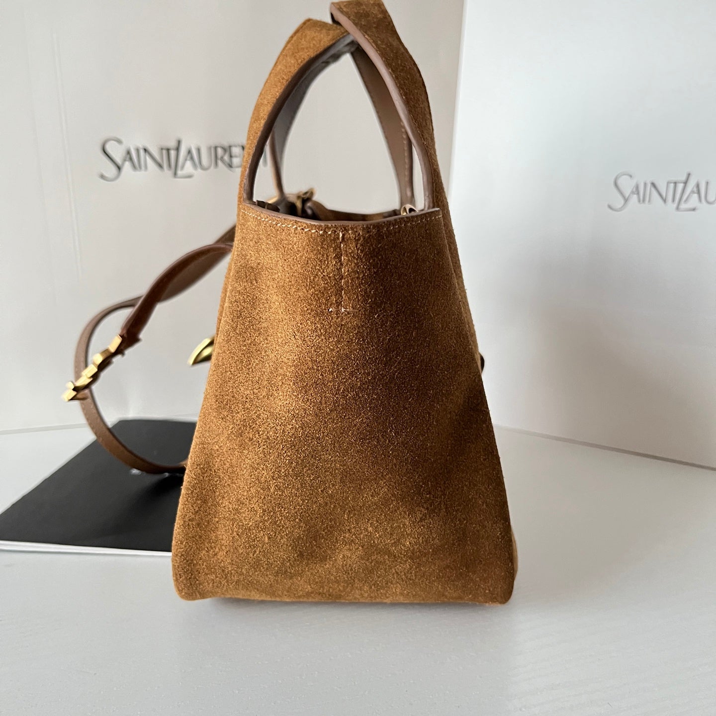 YSL tan suede mini tote with open top, structured shape, and shoulder strap