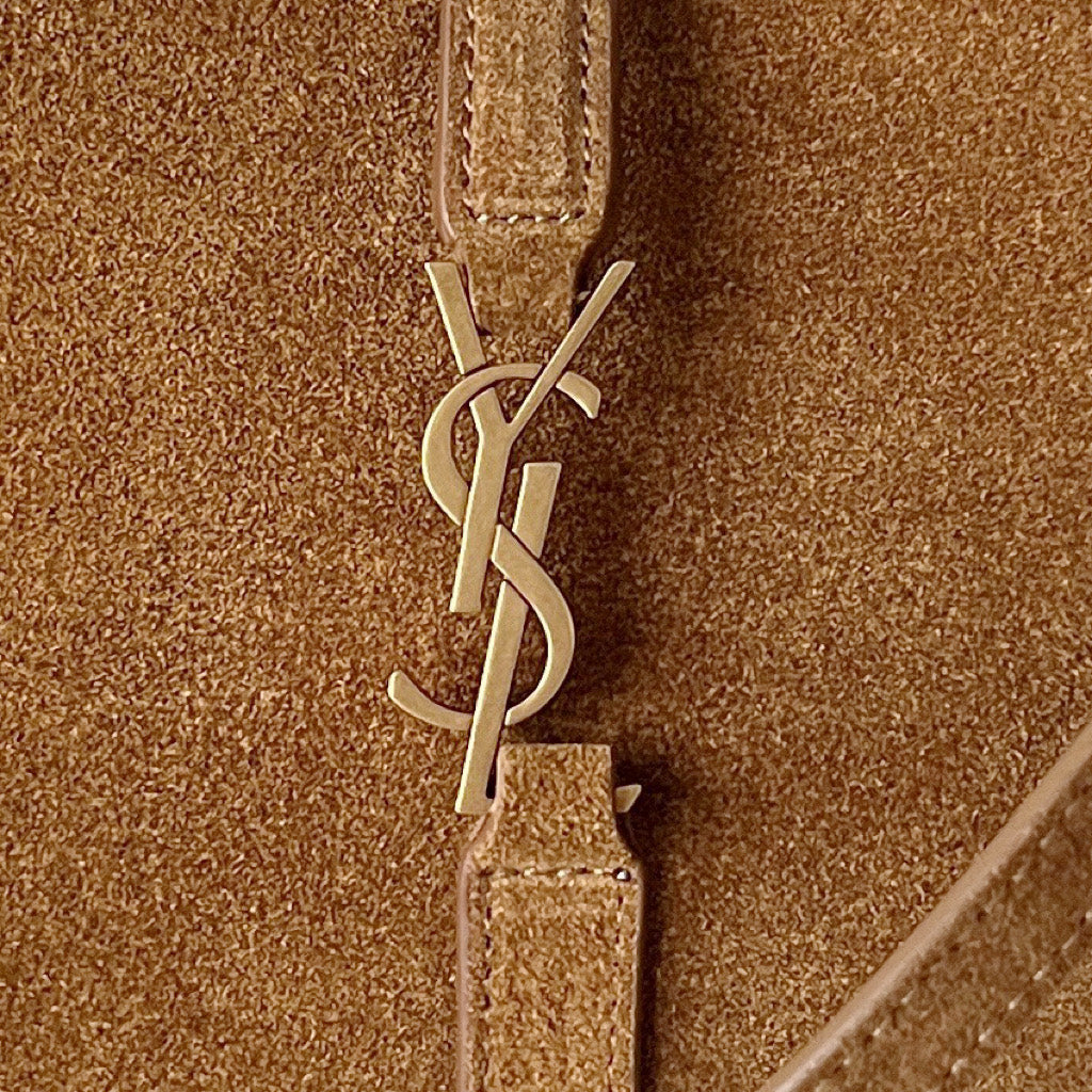 YSL tan suede bag with YSL logo zipper pull and textured suede detail