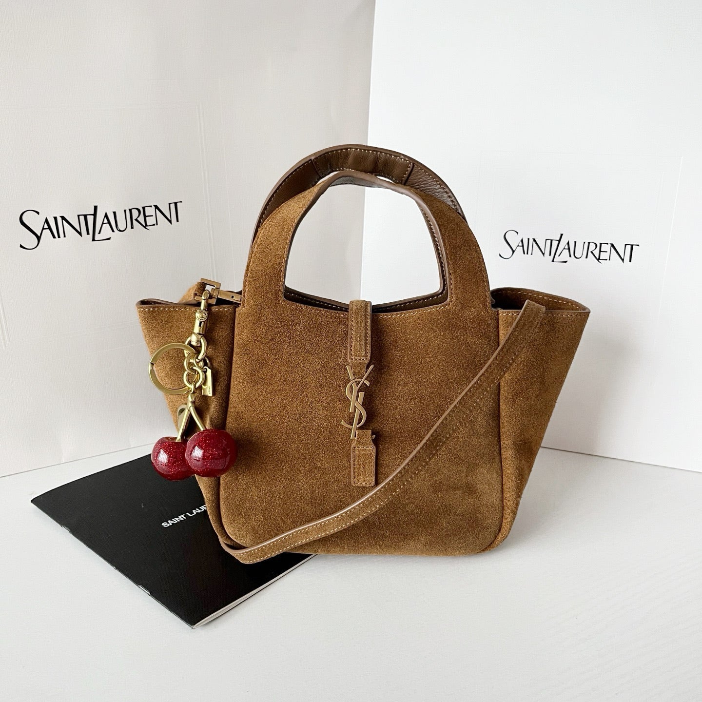 YSL tan suede mini tote with top handles, gold hardware, and side shoulder strap